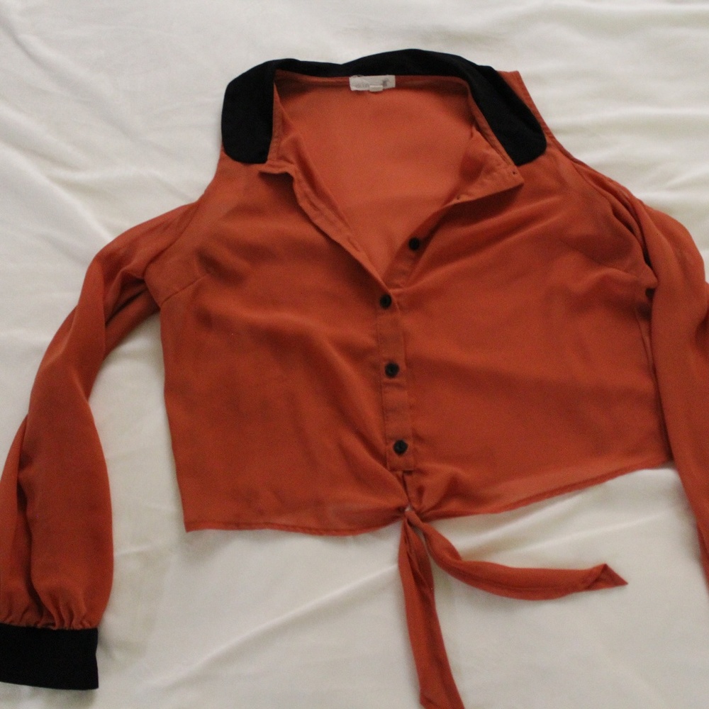 Orange and black long sleeve with shoulder cut out